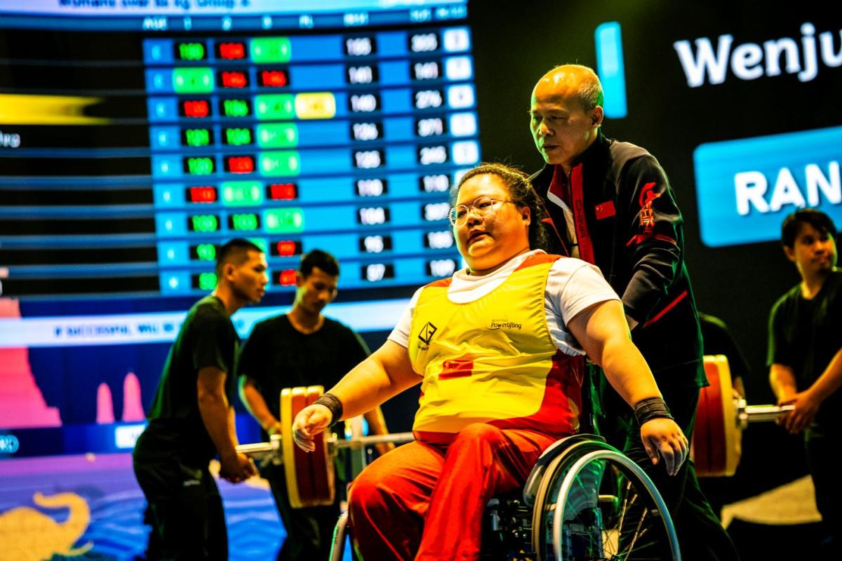 An athlete gestures before attempting a lift