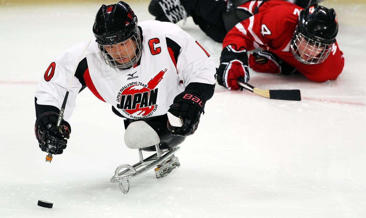 Japanese Ice Sledge Hockey player performing against Canada at Vancouver 2010 Japanese Ice Sledge Hockey player performing against Canada at Vancouver 2010