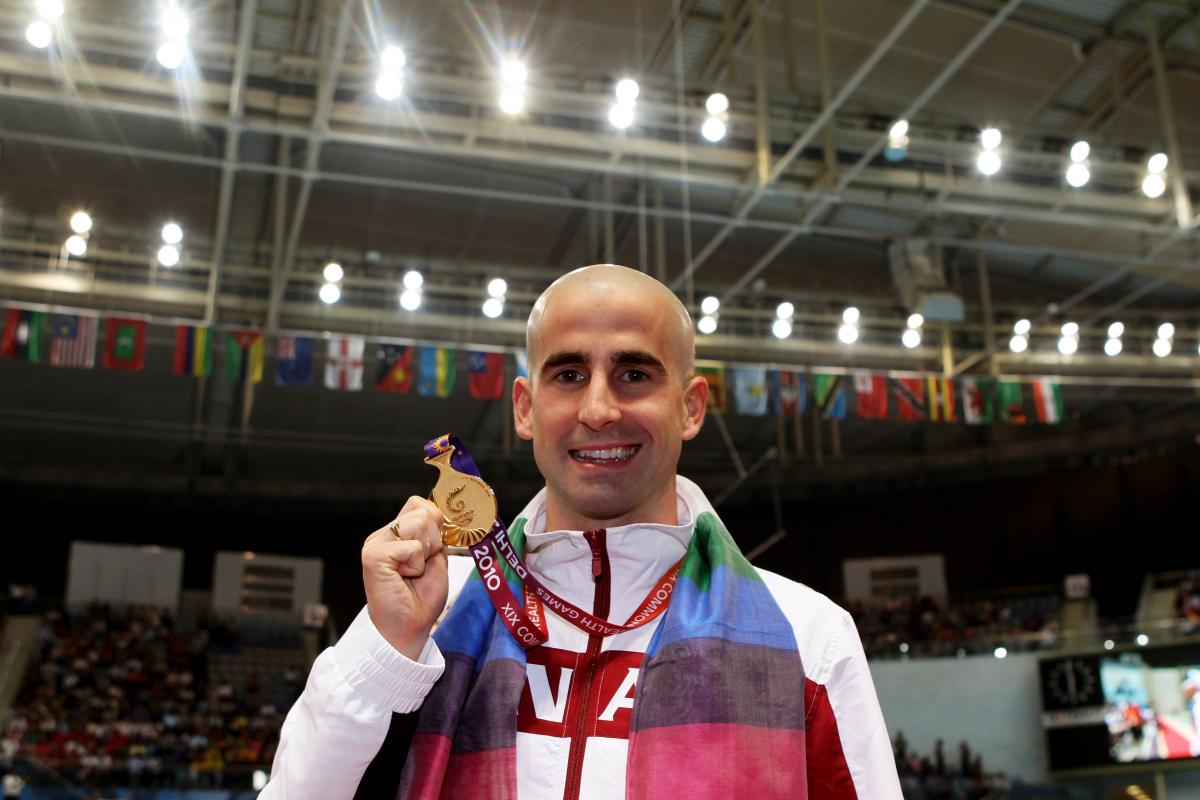 Benoit Huot posing with medal