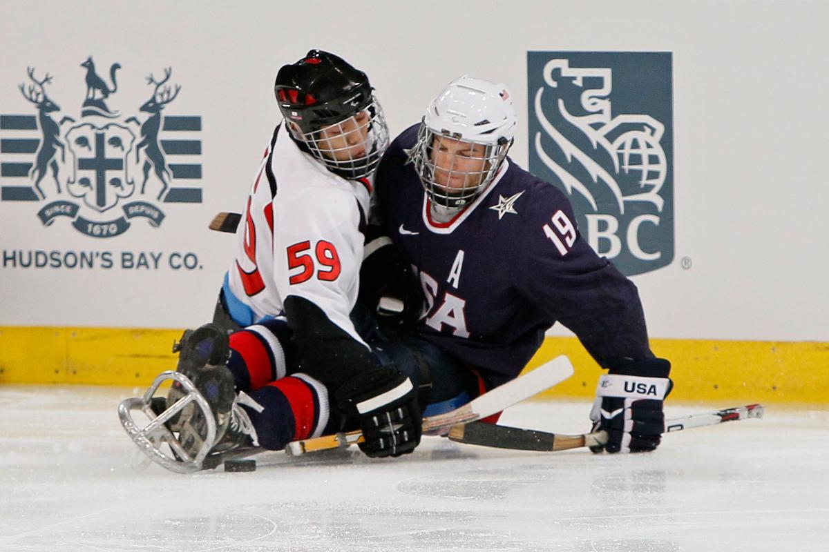 Noritaka Ito and Taylor Chace Noritaka Ito and Taylor Chace battling for the puck.