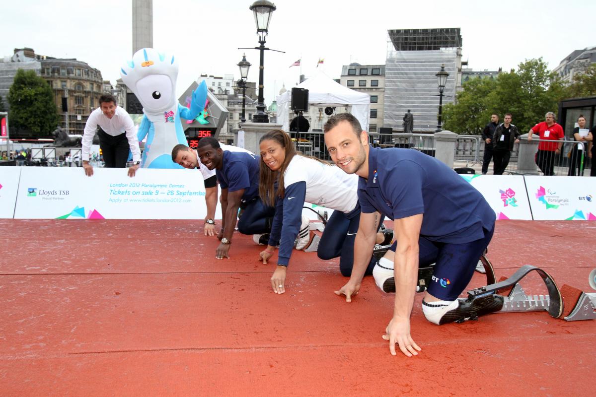 Oscar Pistorius (RSA), April Holmes (USA), Jerome Singleton (USA) and Heinrich Popow (GER) preparing for a friendly 100m race during the 2011 International Paralympic Day in Trafalgar Square in London, Great Britain