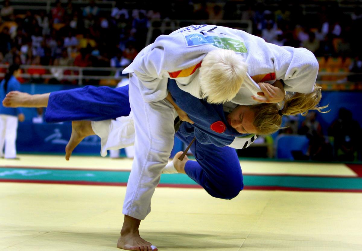 a picture of 2 athletes competing in a judo match