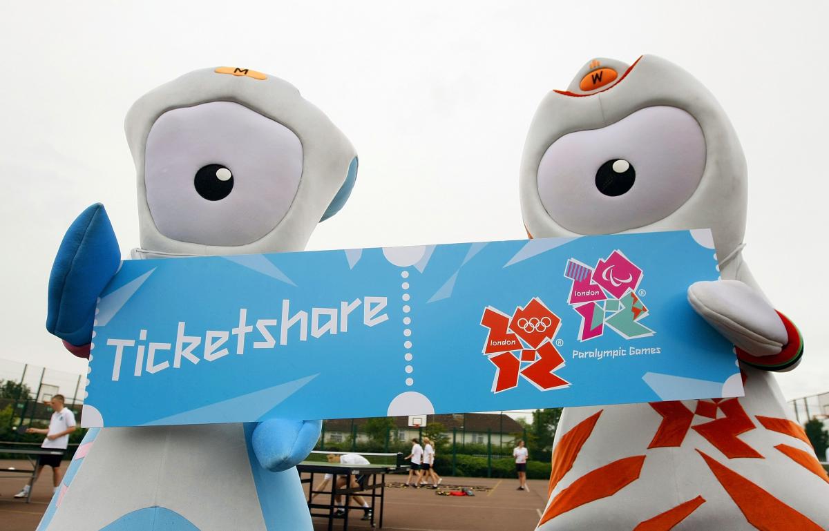 Mascots pose for photographs A picture of 2 mascots
