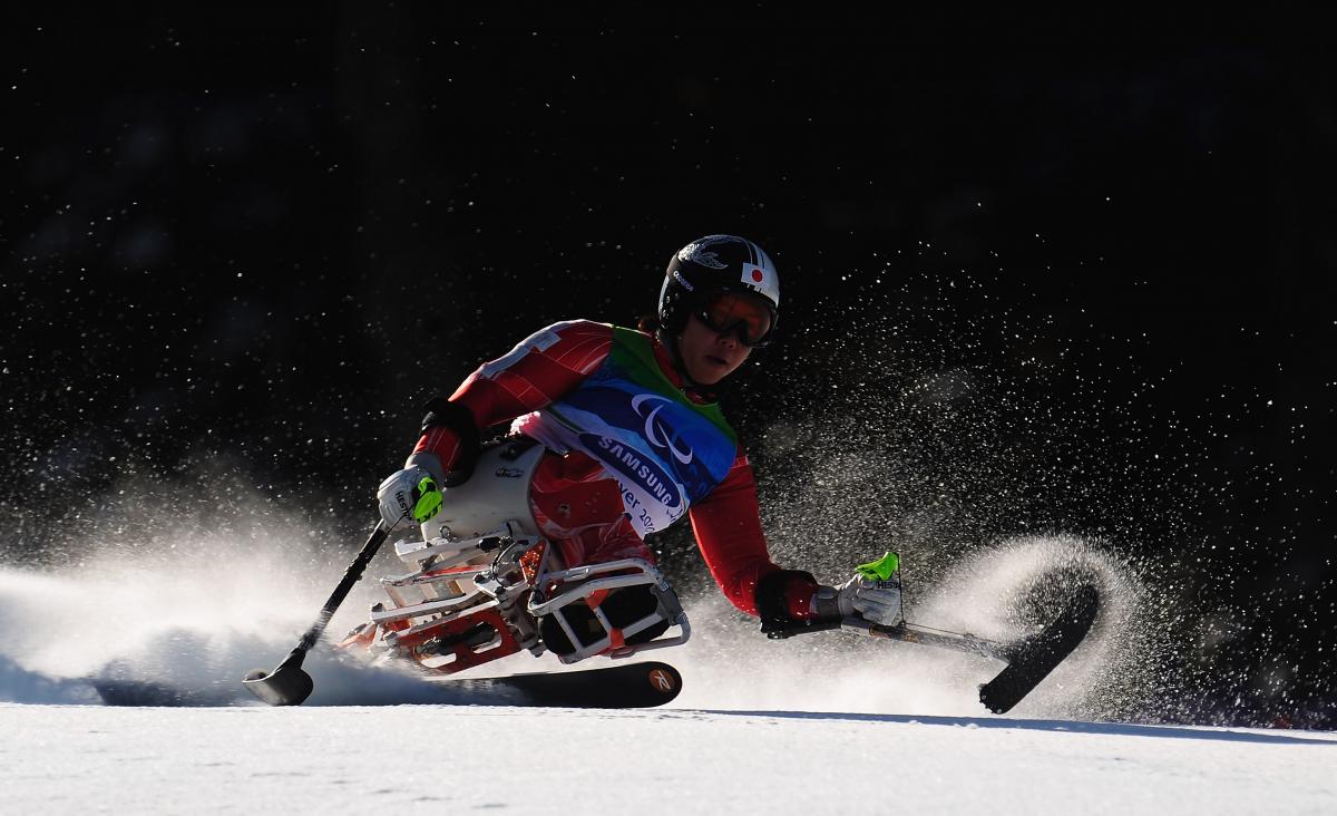 A picture of a woman skiing