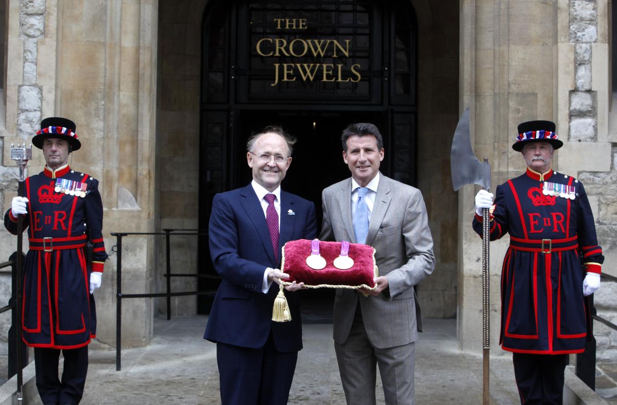 A picture of 2 men showing medals together