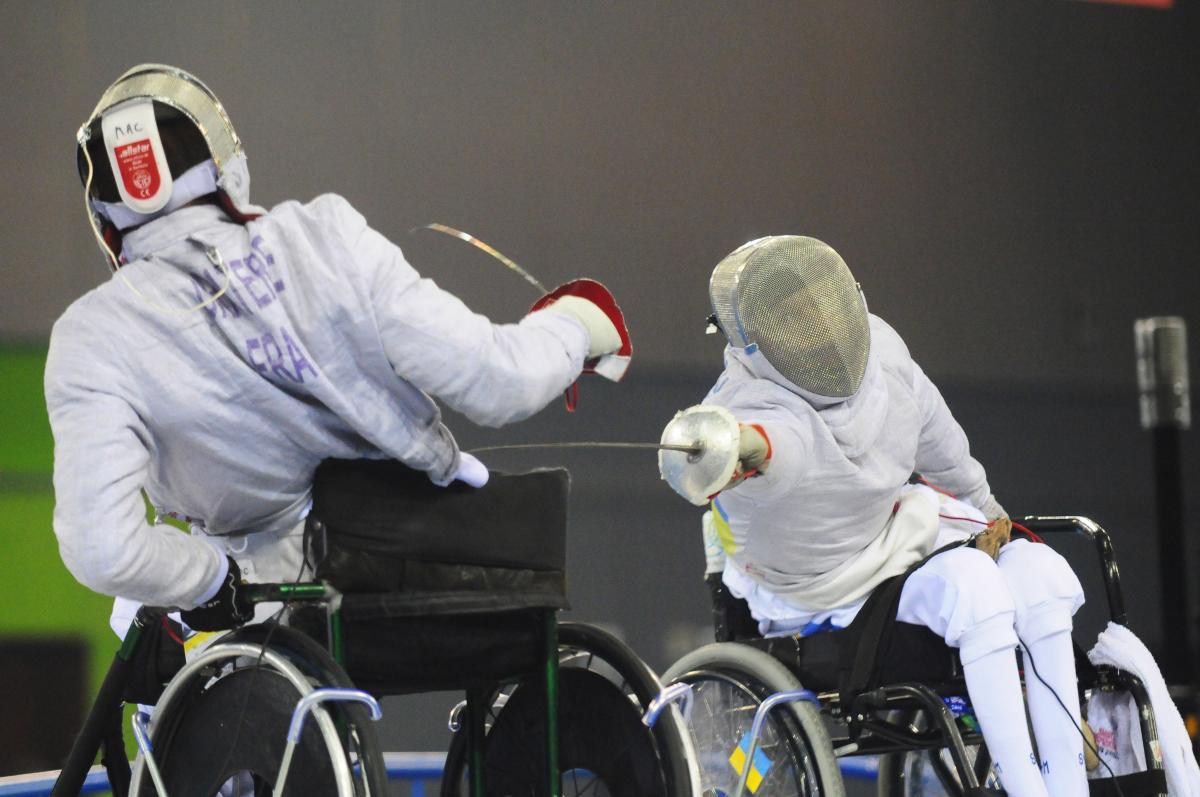 Serhiy Shenkevych and Marc-Andre Cratere A picture of 2 mens in wheelchair practising fencing