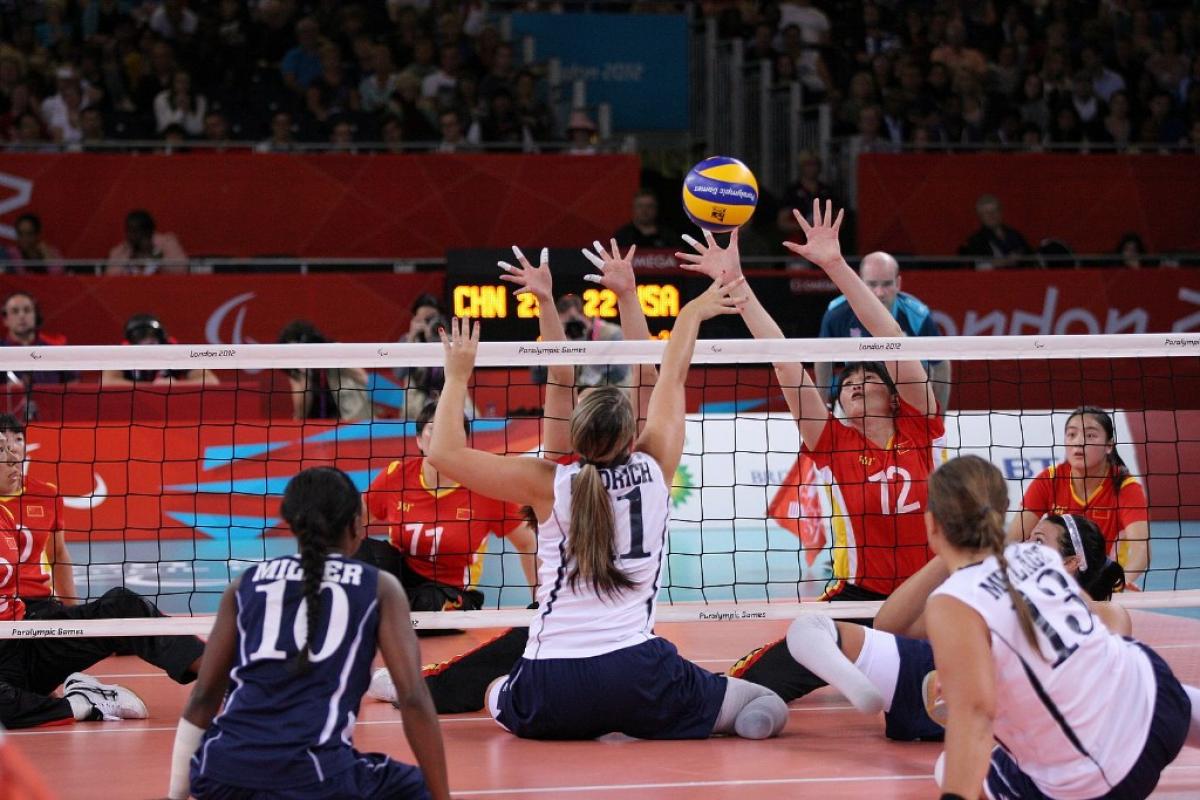 Sitting Volley Ball USA vs. China A picture of women playing Sitting Volleyball