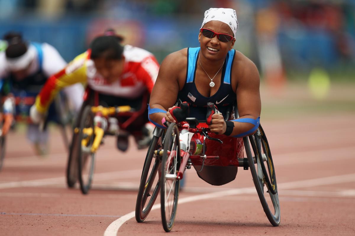 Anjali Forber Pratt A picture of a woman in wheelchair celebrating her victory
