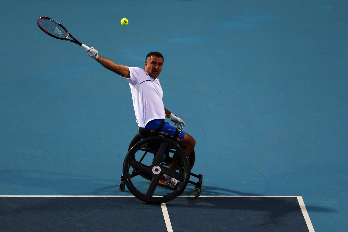 Stephane Houdet A picture of a man in a wheelchair playing tennis