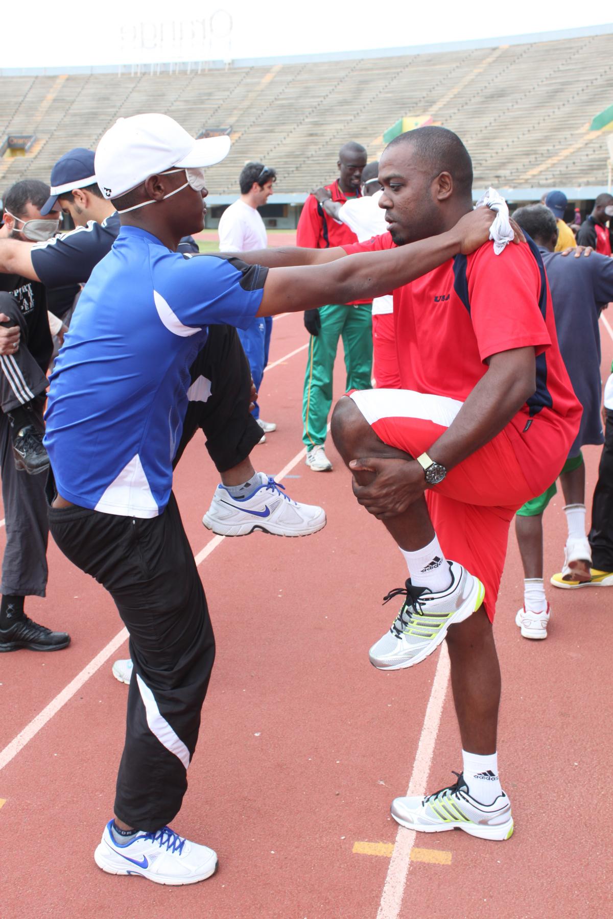 A picture of two athletes warming up