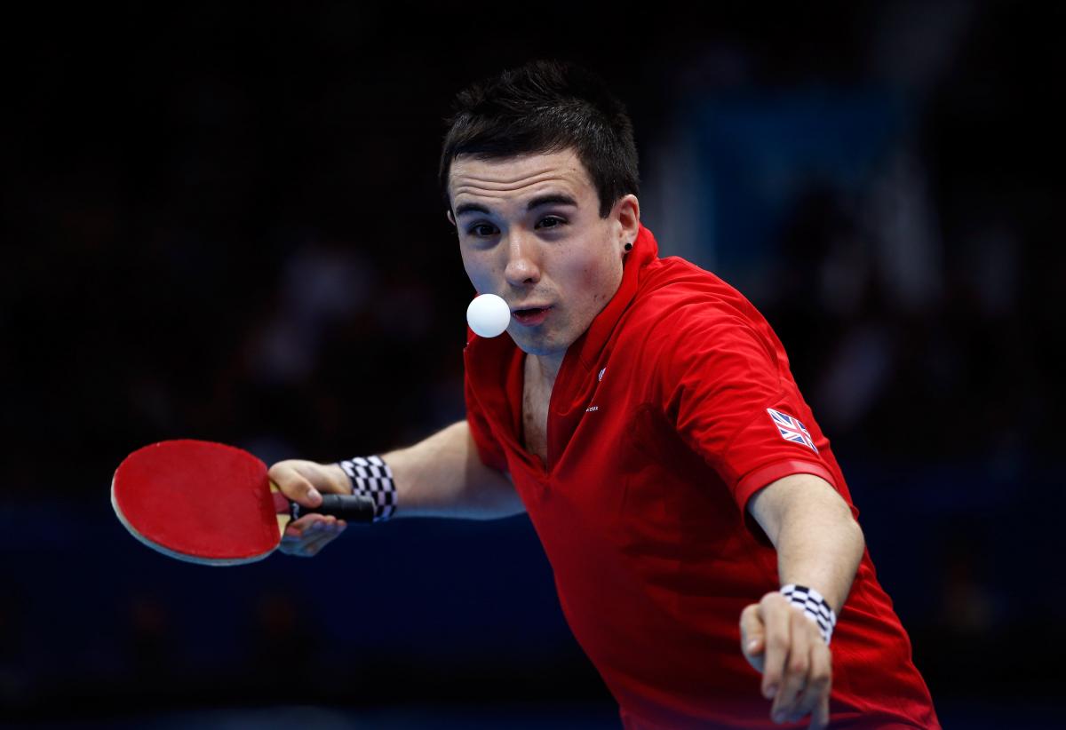 A picture of a man playing table tennis