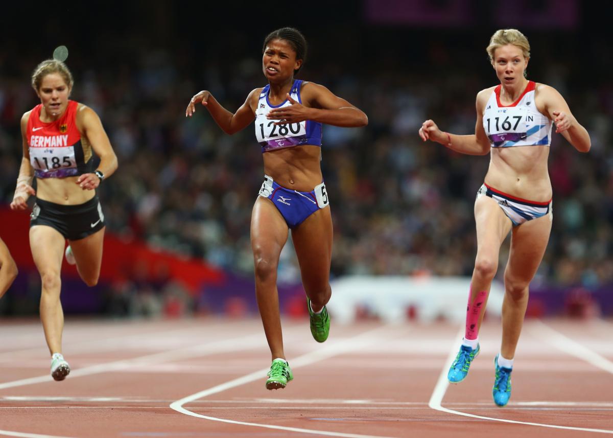 A picture of three women running during an athletics event