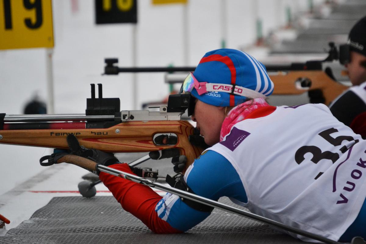 A picture of a woman shooting.