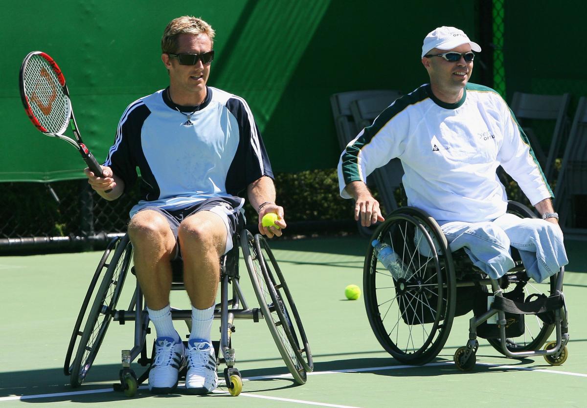 Wheelchair tennis legend David Hall (right) introduces Jonas Bjorkman to the sport (left)
