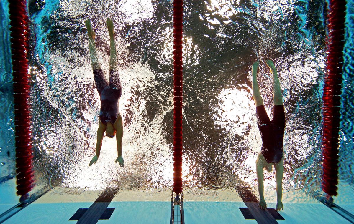 Sarah Louise Rung A picture of women in the pool touching the wall with their hands