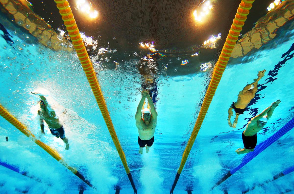 A picture of three men underwater