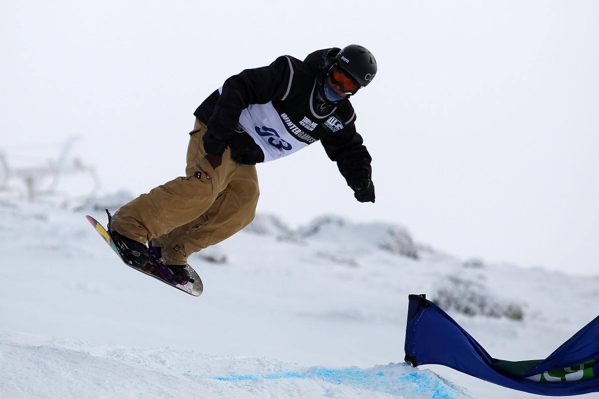 A picture of a man practising snowboard