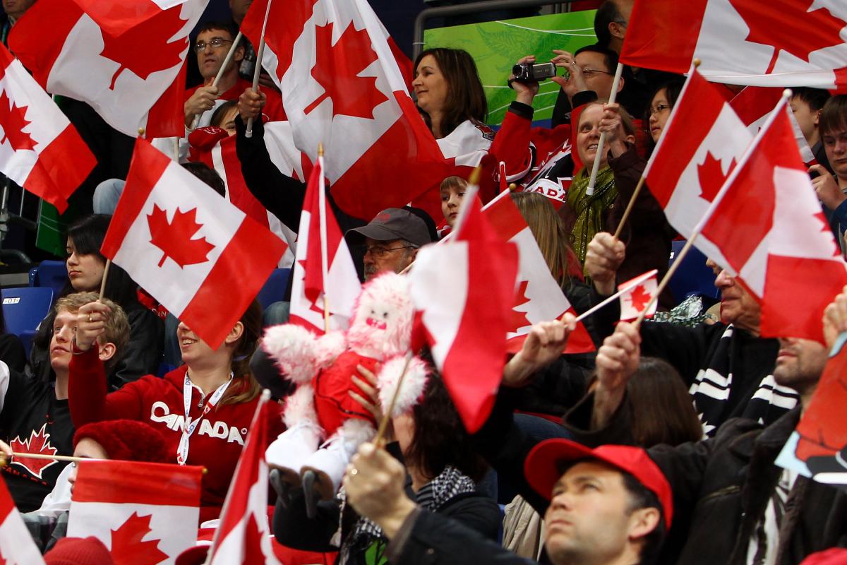 A picture of supporters waving canadian flags