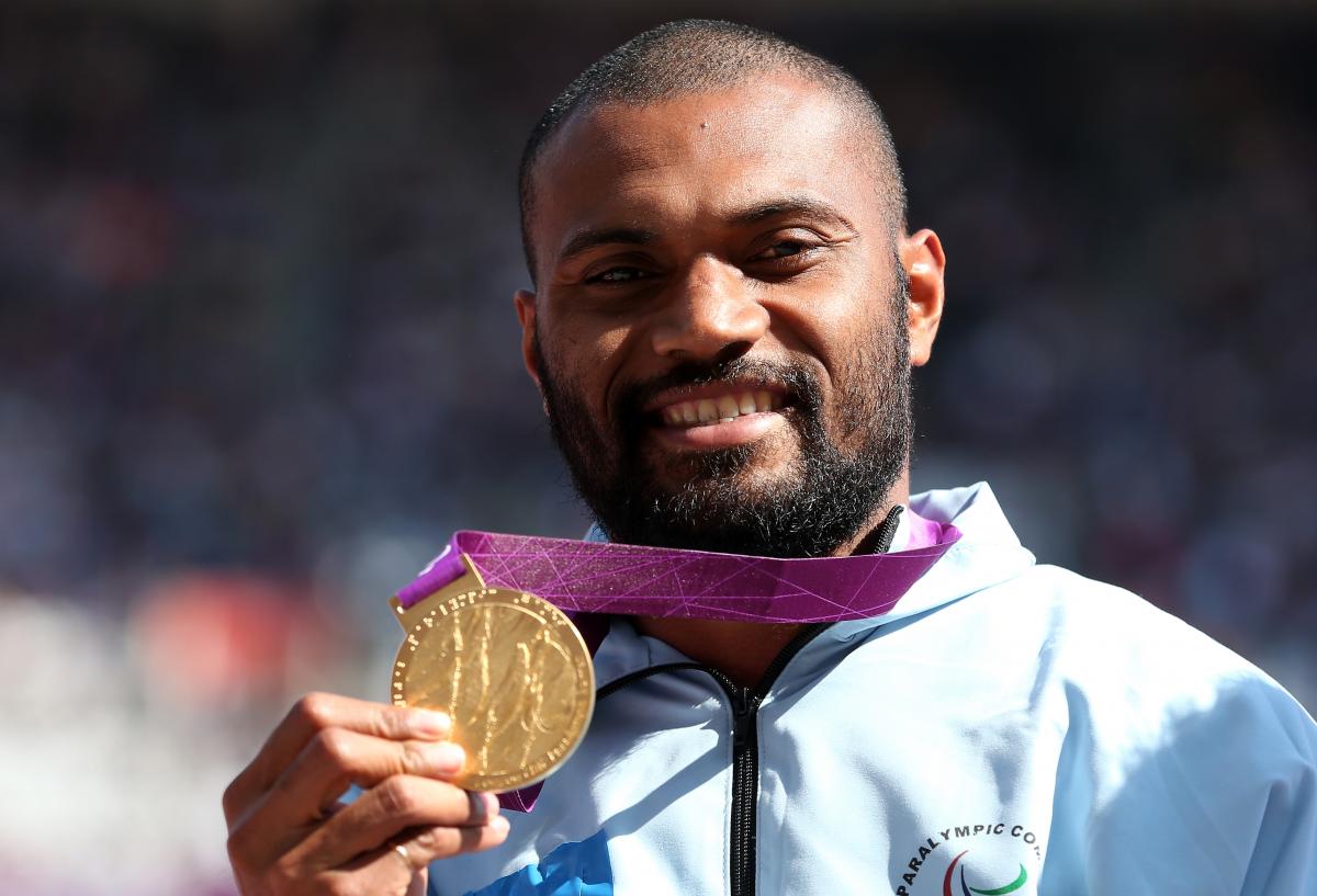 A picture of a man with a medal around his neck