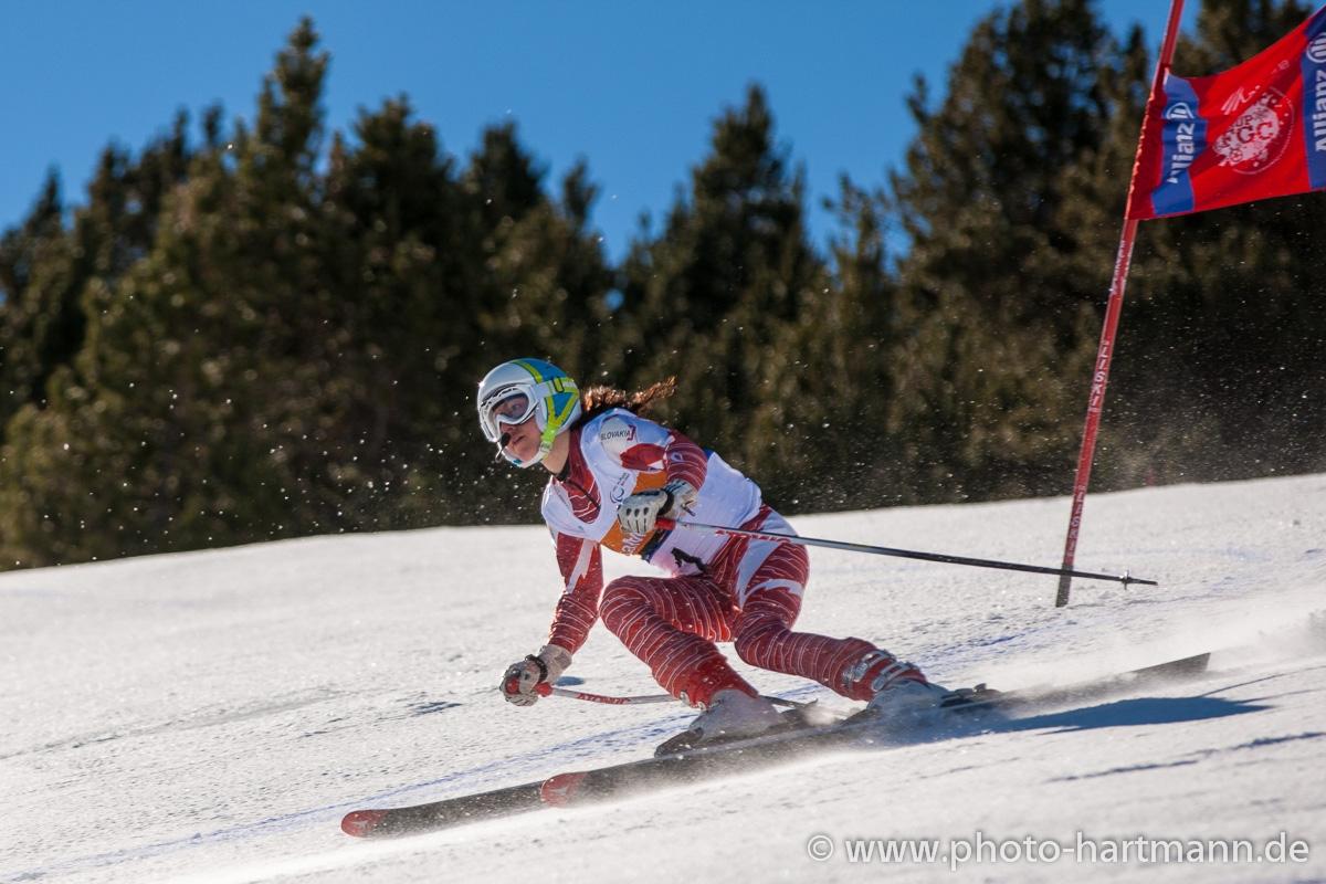 A picture of a woman skiing on the slopes