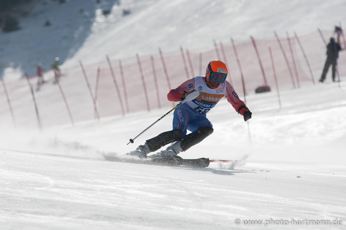 A picture of a man skiing on the slopes