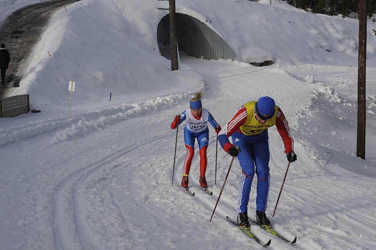 A picture of a woman skiing on a track