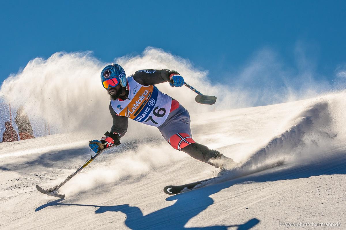 A picture of a man skiing on the slopes