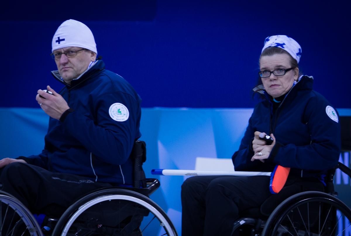 A picture of a man and a woman in wheelchairs