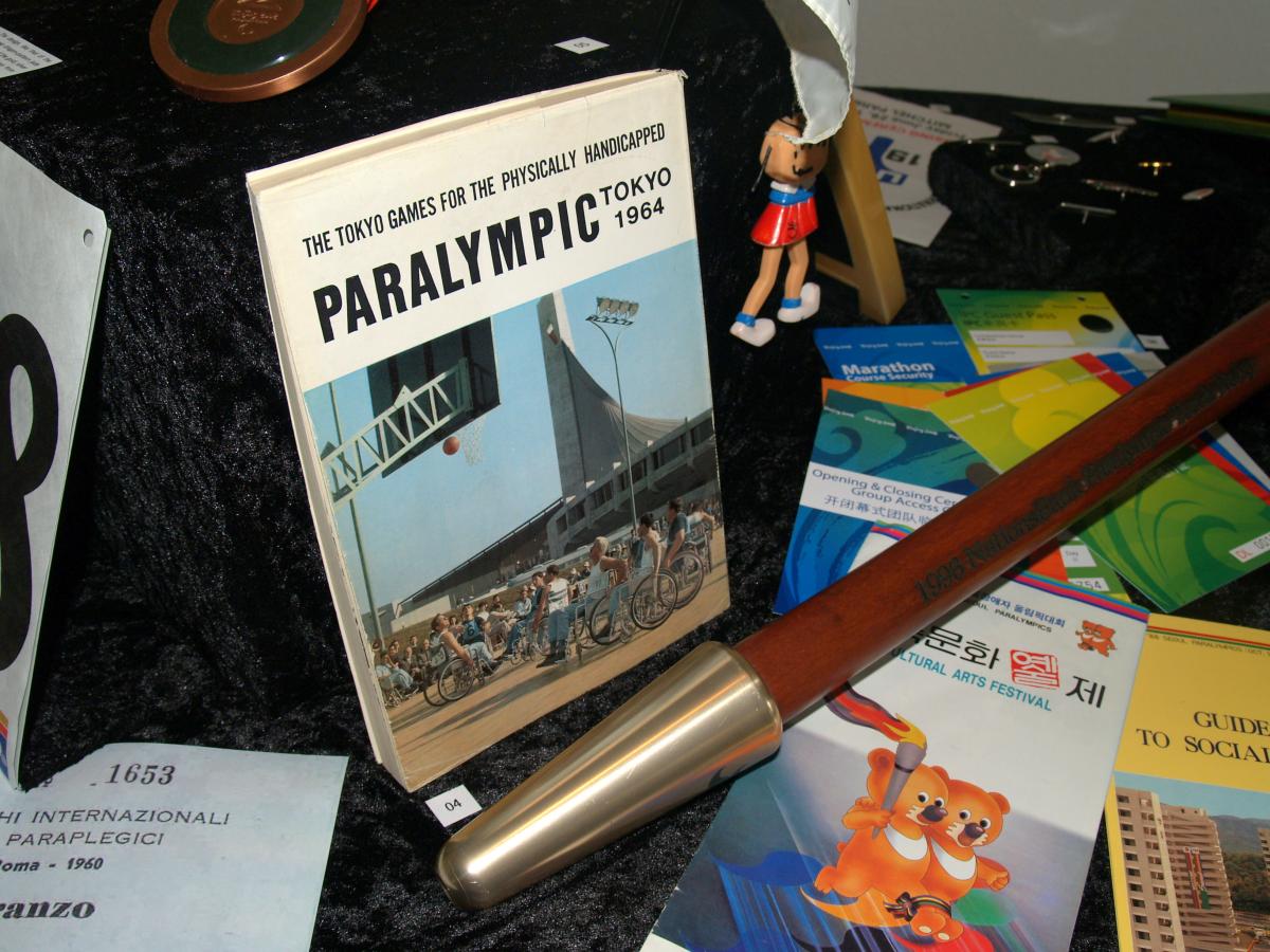books, torch, Paralympic pins