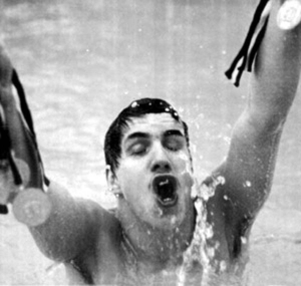 Tim McIsaac A picture of man in a pool celebrating his victory