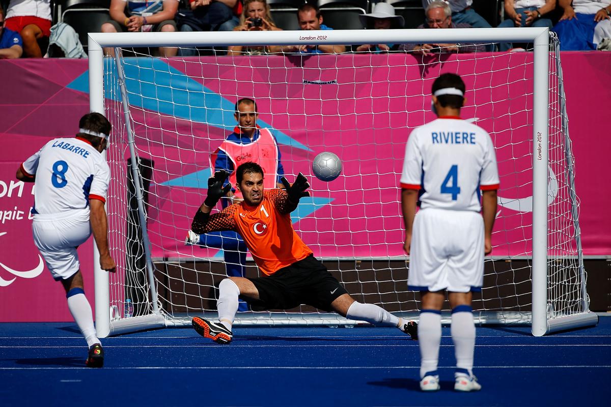 David Labarre of France scores a penalty against Ali Hidir Kurt of Turkey - Football 5-a-side