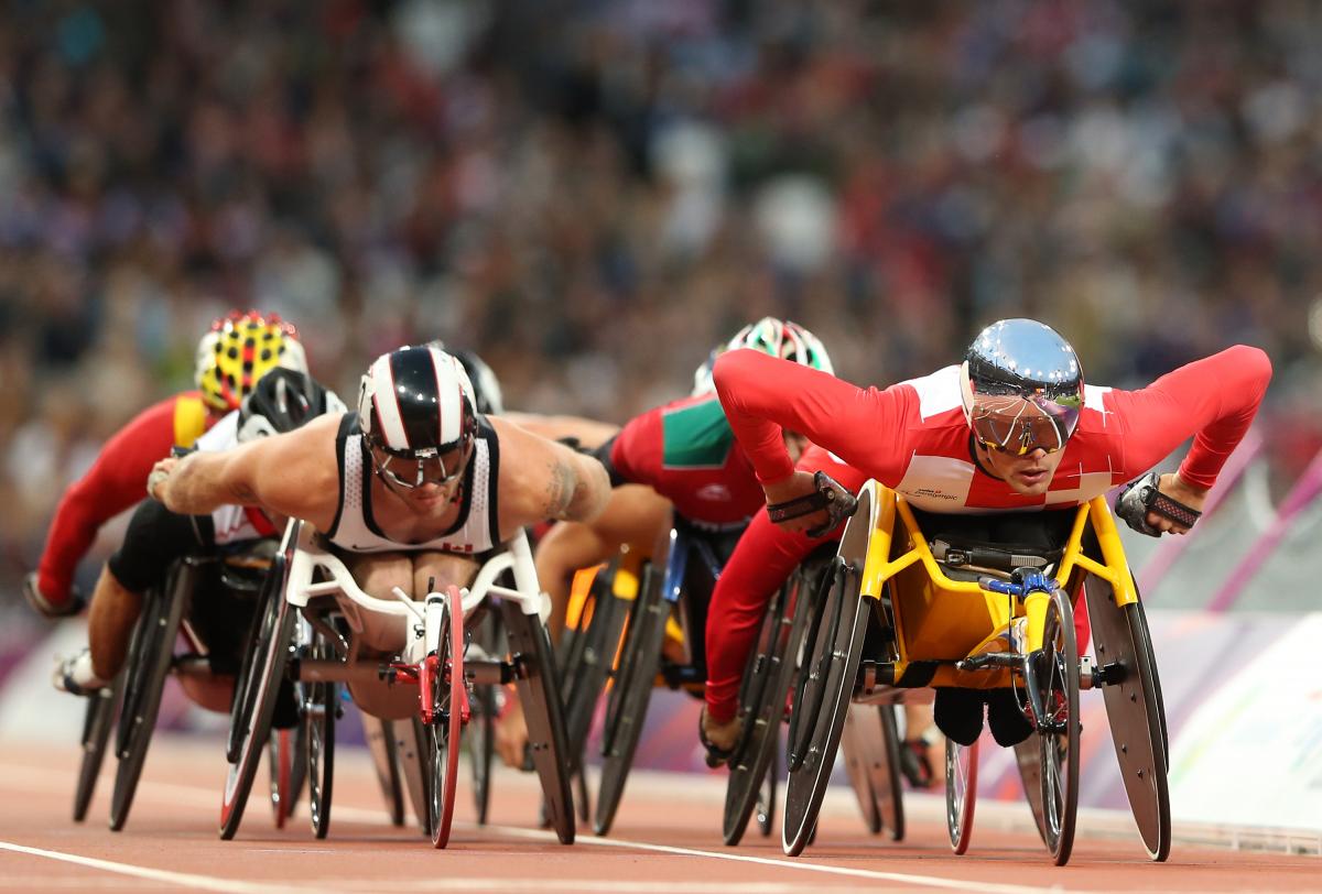 Marcel Hug of Switzerland (R) and Josh Cassidy of Canada compete in the Men's 5000m - T54 heats on day two of the London 2012 Paralympic Games at Olympic Stadium.