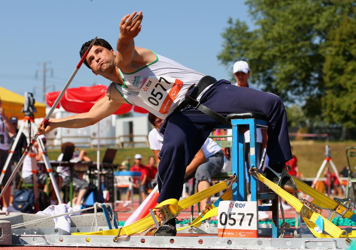 An athlete throws a javelin