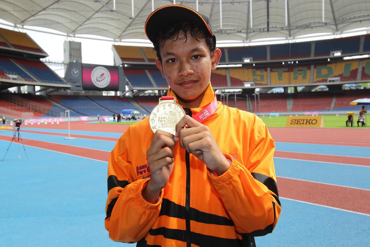 Fitri Ghani wins the first gold at the Athletics venue at the 2013 Asian Youth Para Games
