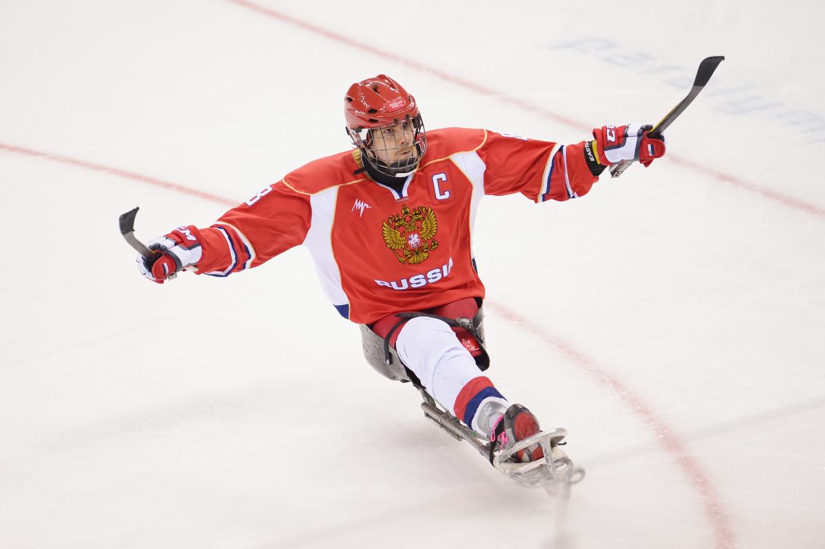 Dmitrii Lisov of Russia celebrates after scoring a penalty during the Ice Sledge Hockey match between the Russia and Korea