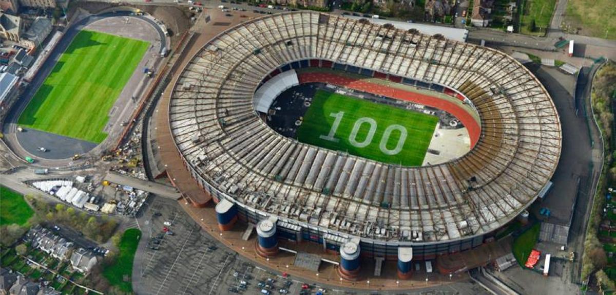 Picture of Glasgow 2014 stadium with 100 days to go written in the grass