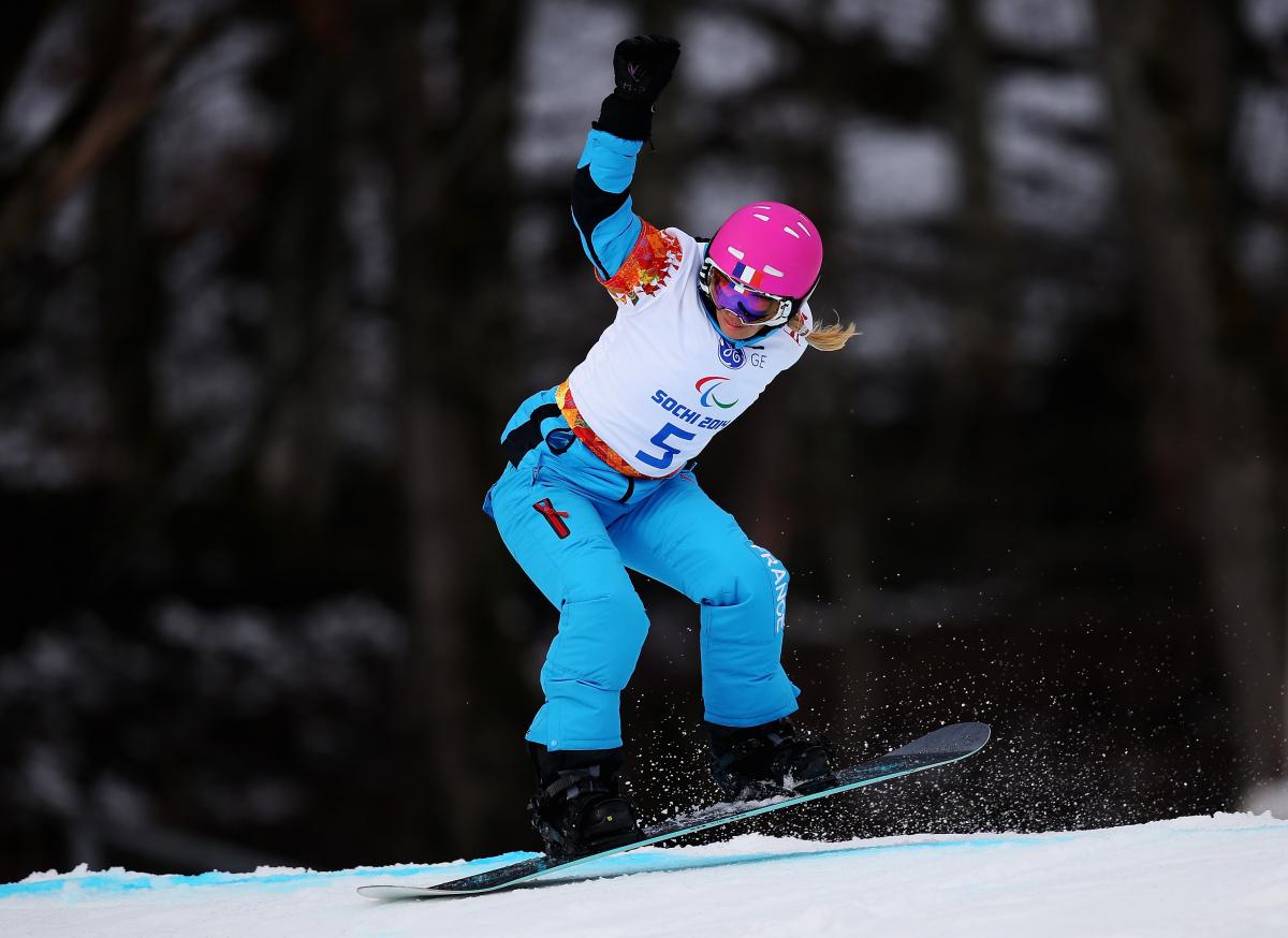 Cecile Hernandez-Cervellon Cecile Hernandez-Cervellon snowboards down the course at Sochi 2014.
