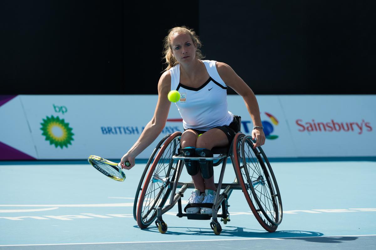 Athlete in a competition of wheelchair tennis.