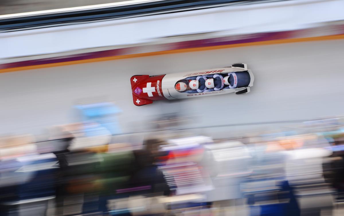 A bobsleigh goes so fast down the track it's a blur.