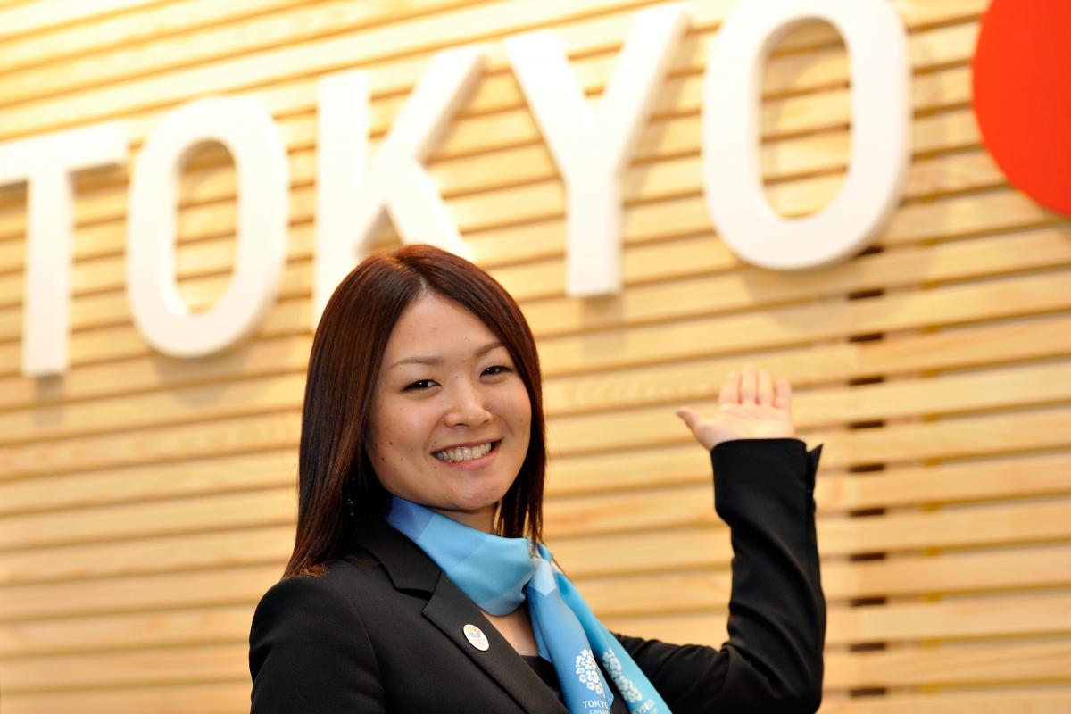 A woman speaks at a podium.