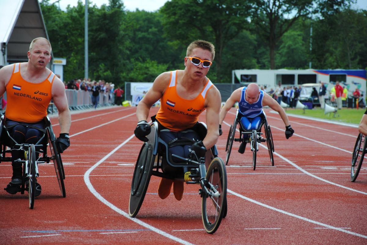 Wheelchair racer crosses the finish line