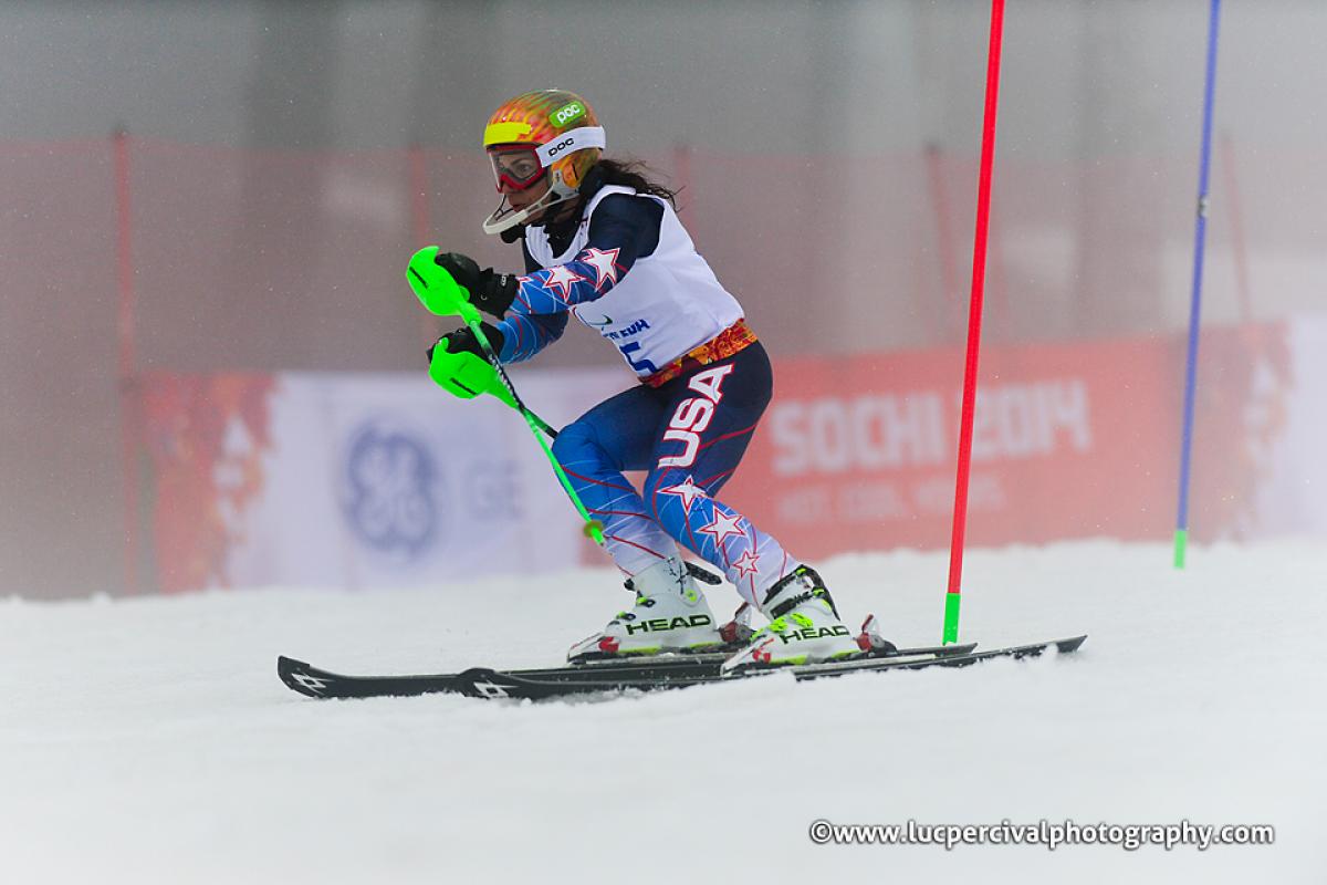 Danelle Umstead - Sochi 2014 Winter Paralympic Games Women passing a slalom pole on the slopes