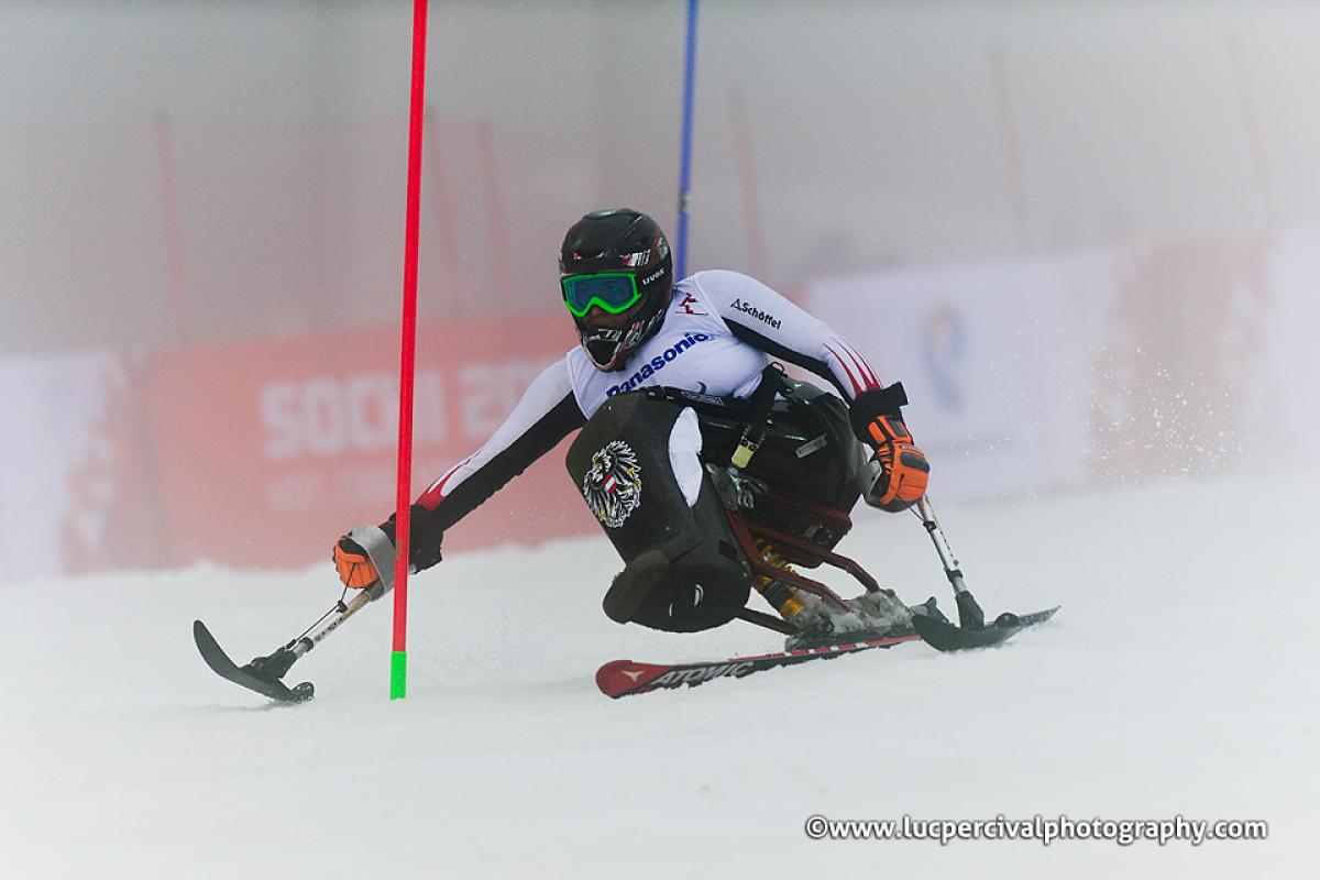 Woman on sit ski on the slopes