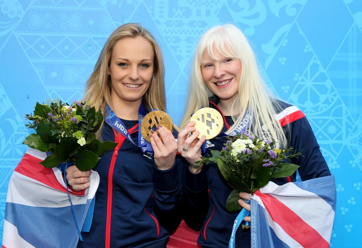 Great Britain's Kelly Gallagher (right) and guide Charlotte Evans (left) celebrate winning Sochi 2014 gold in the women's Super-G