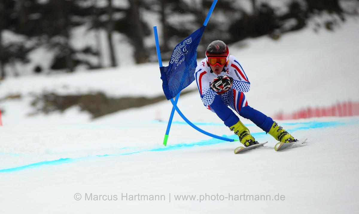 Alexey Bugaev, Russian Federation is so fast his speed moves the gates and takes the gold medal