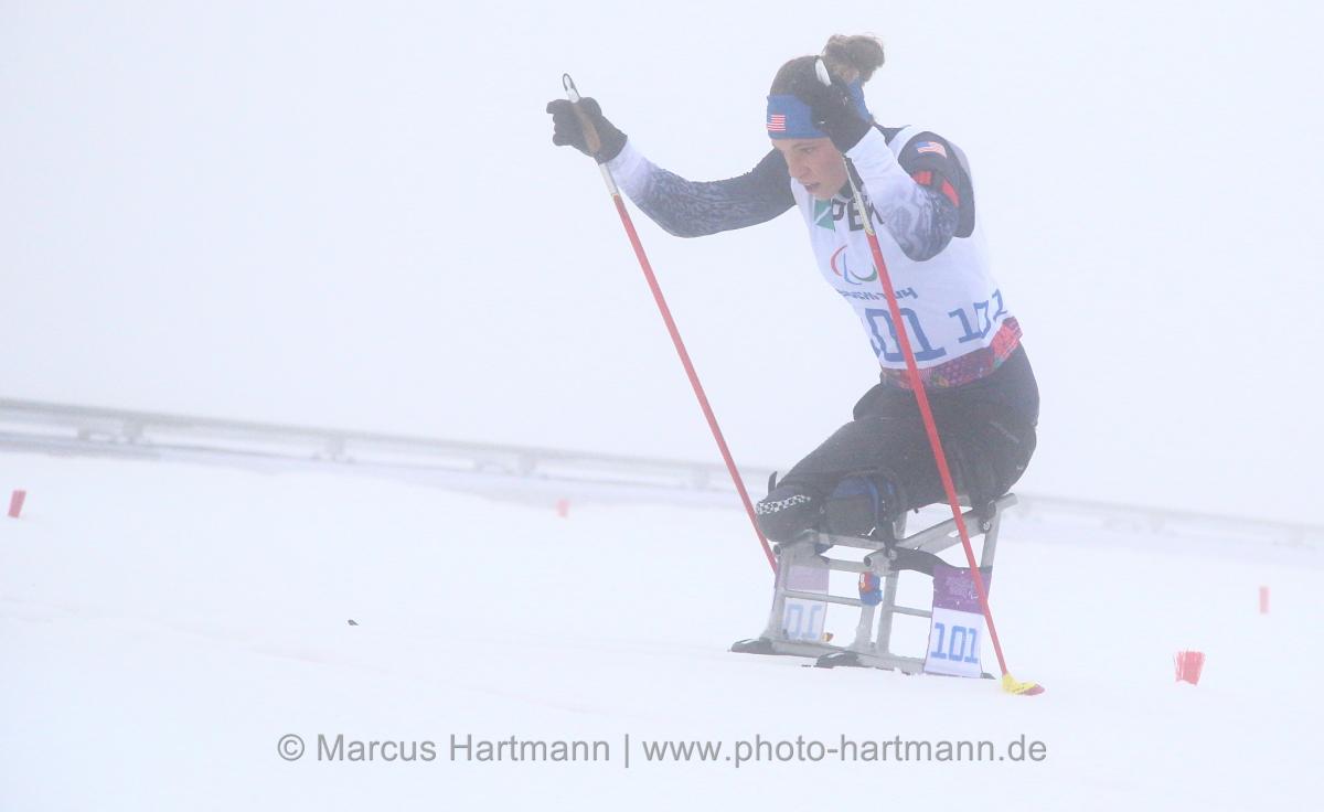 Oksana Masters, USA on the uphill climb in her sitski.