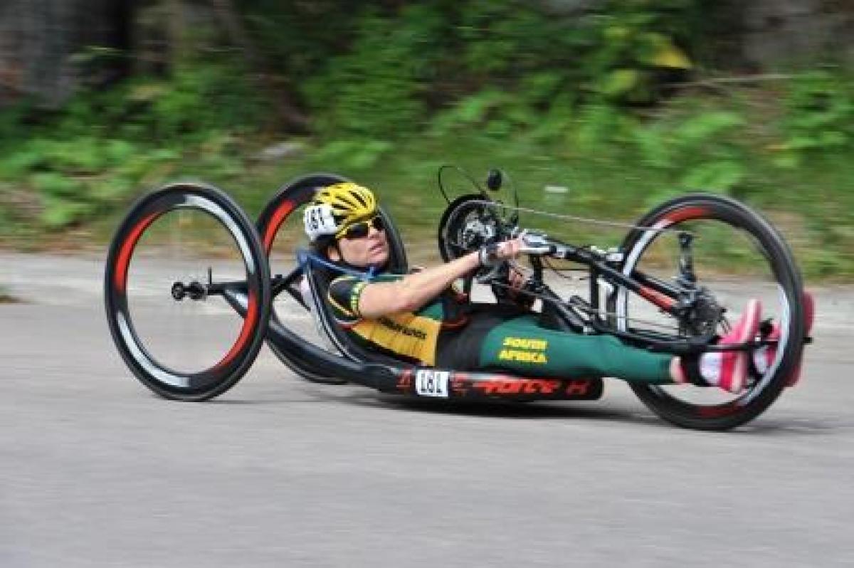 Women in hand-bike racing on a road