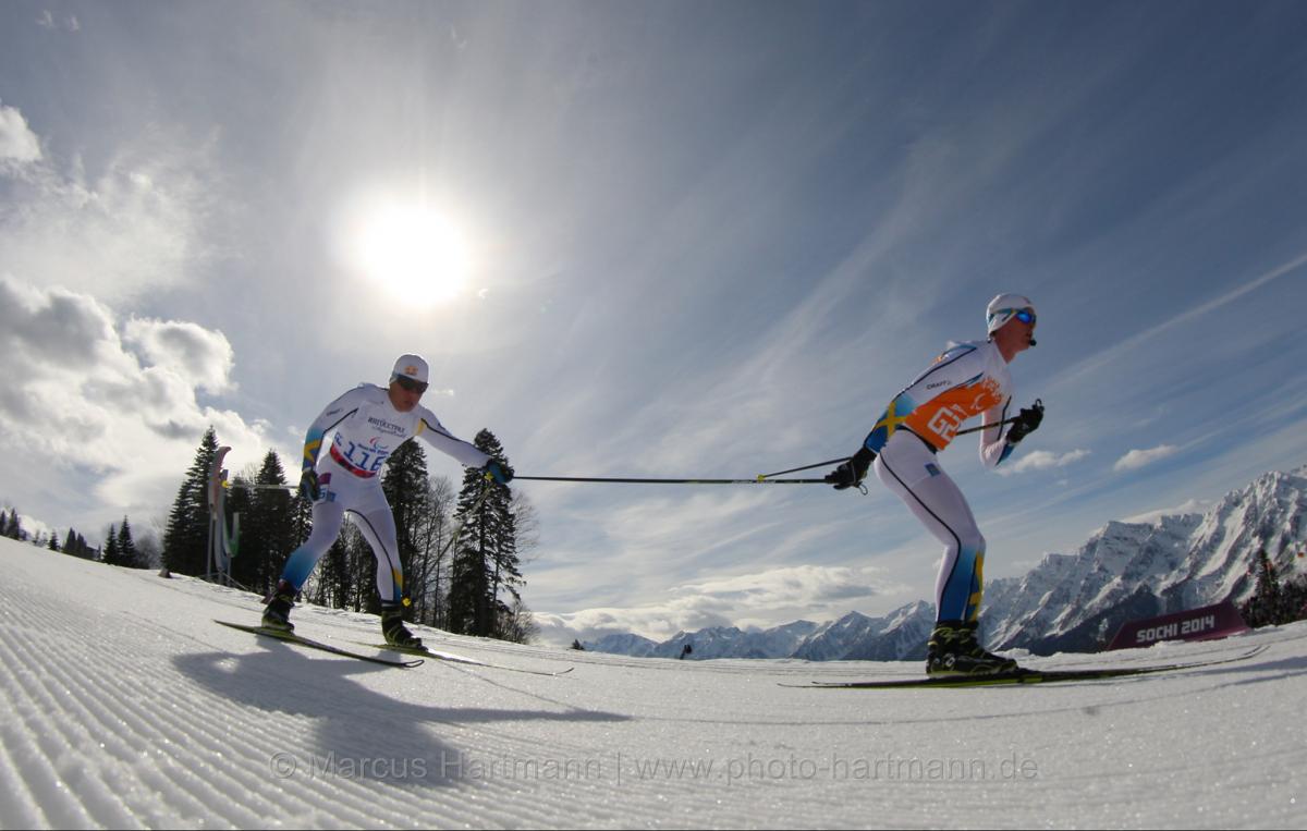 Zebastian Modin, Sweeden holds on to his guides pole as he goes downhill