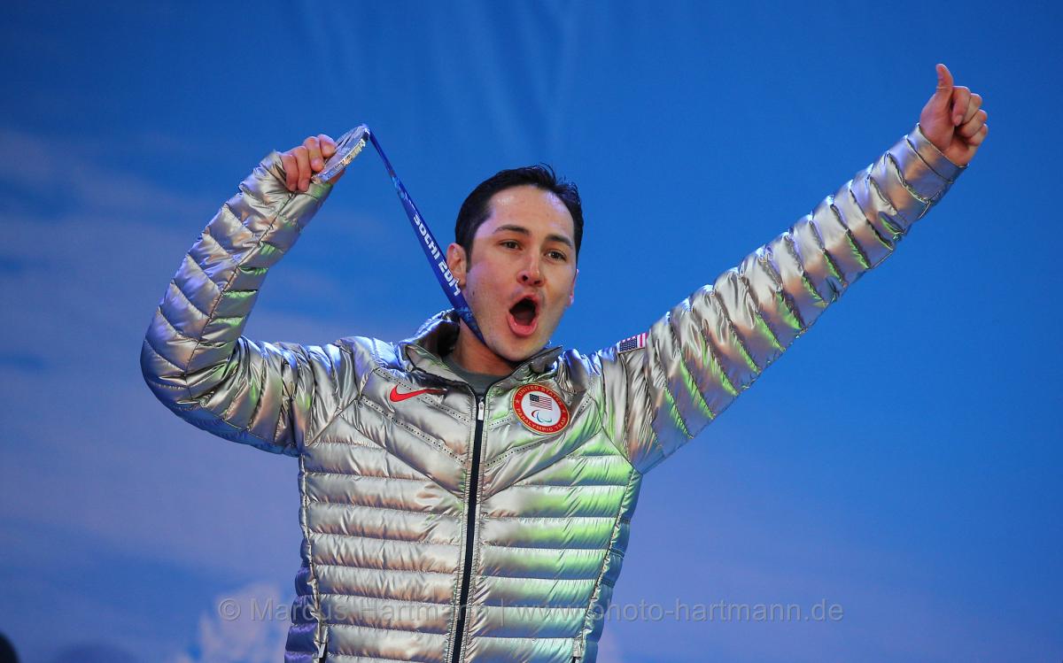 A US para-athlete celebrates winning a medal at the Paralympic Games.