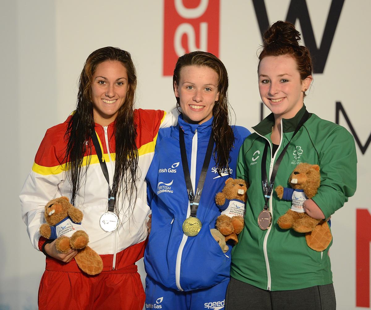 Three female swimmers, Sarai Gascon of Spain, Amy Marren of Great Britain and Ellen Keane of Ireland pose with their 100m butterfly S9 medals at the 2013 IPC Swimming World Championships